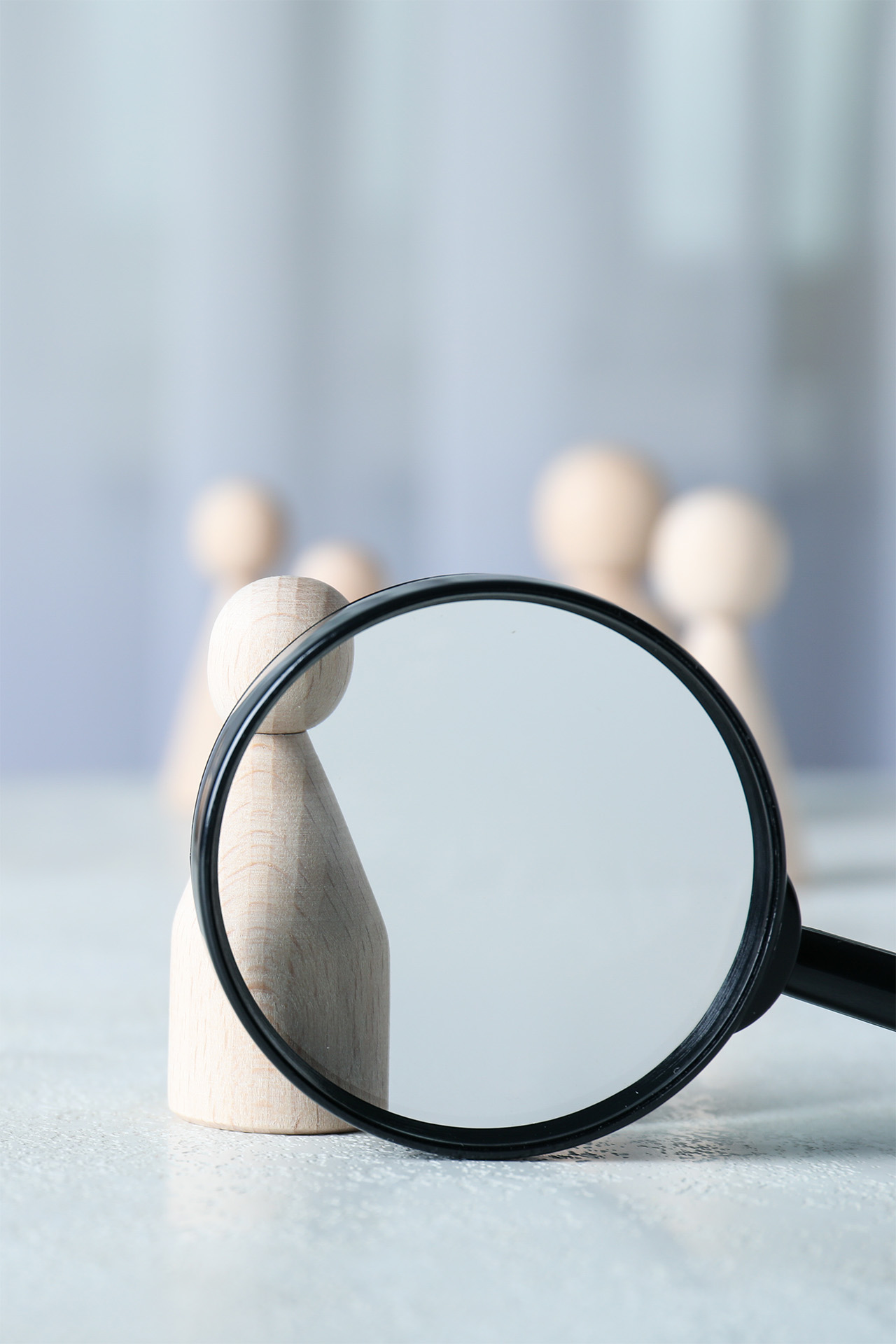 wooden-figures-under-a-magnifying-glass-2026-03-24-21-42-49-utc